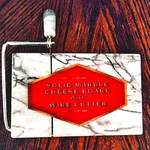 New marble cheese board with cutter.